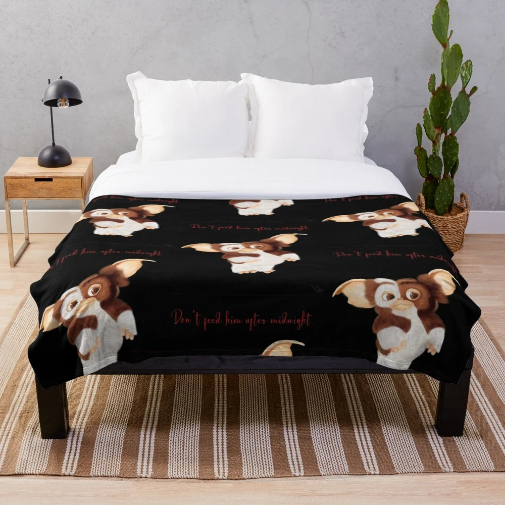 Gizmo-inspired plush blanket with a furry creature design