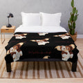 Gizmo-inspired plush blanket with a furry creature design