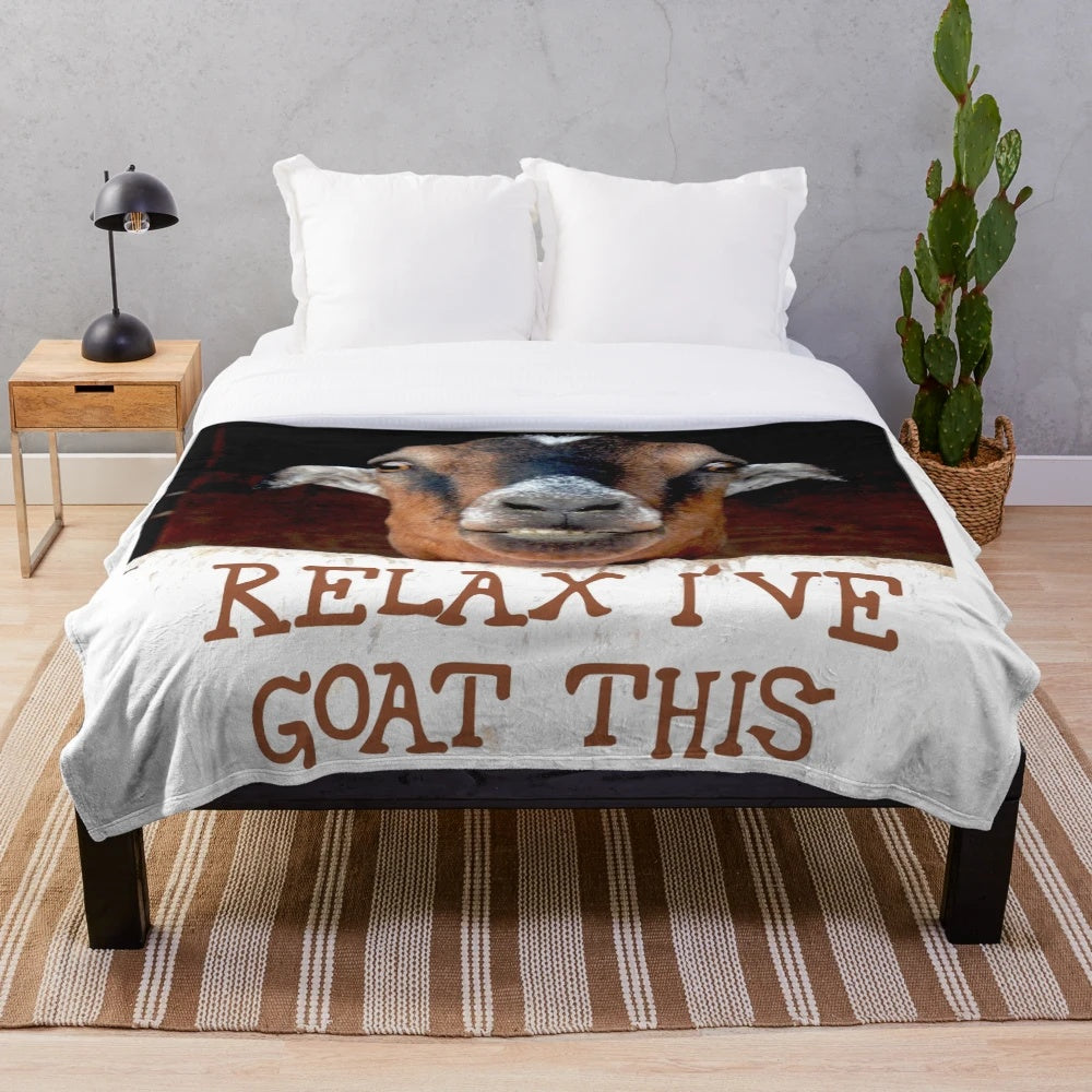 Soft and plush goat-themed blanket with a smiling goat face