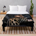 Gold Bengal kitten on a dark background plush blanket