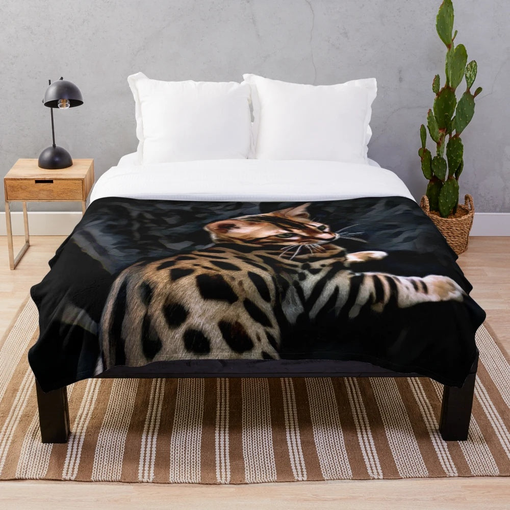 Gold Bengal kitten on a dark background plush blanket