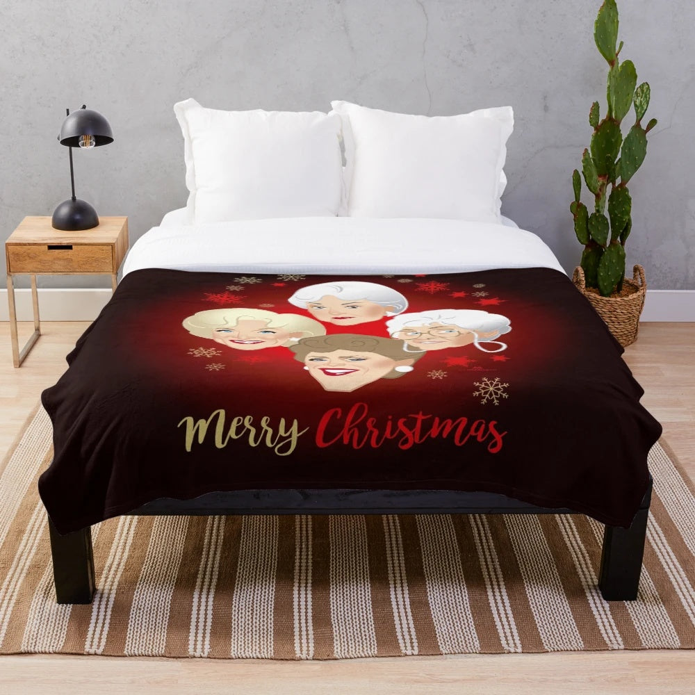 Golden Christmas plush blanket featuring classic TV comedy characters