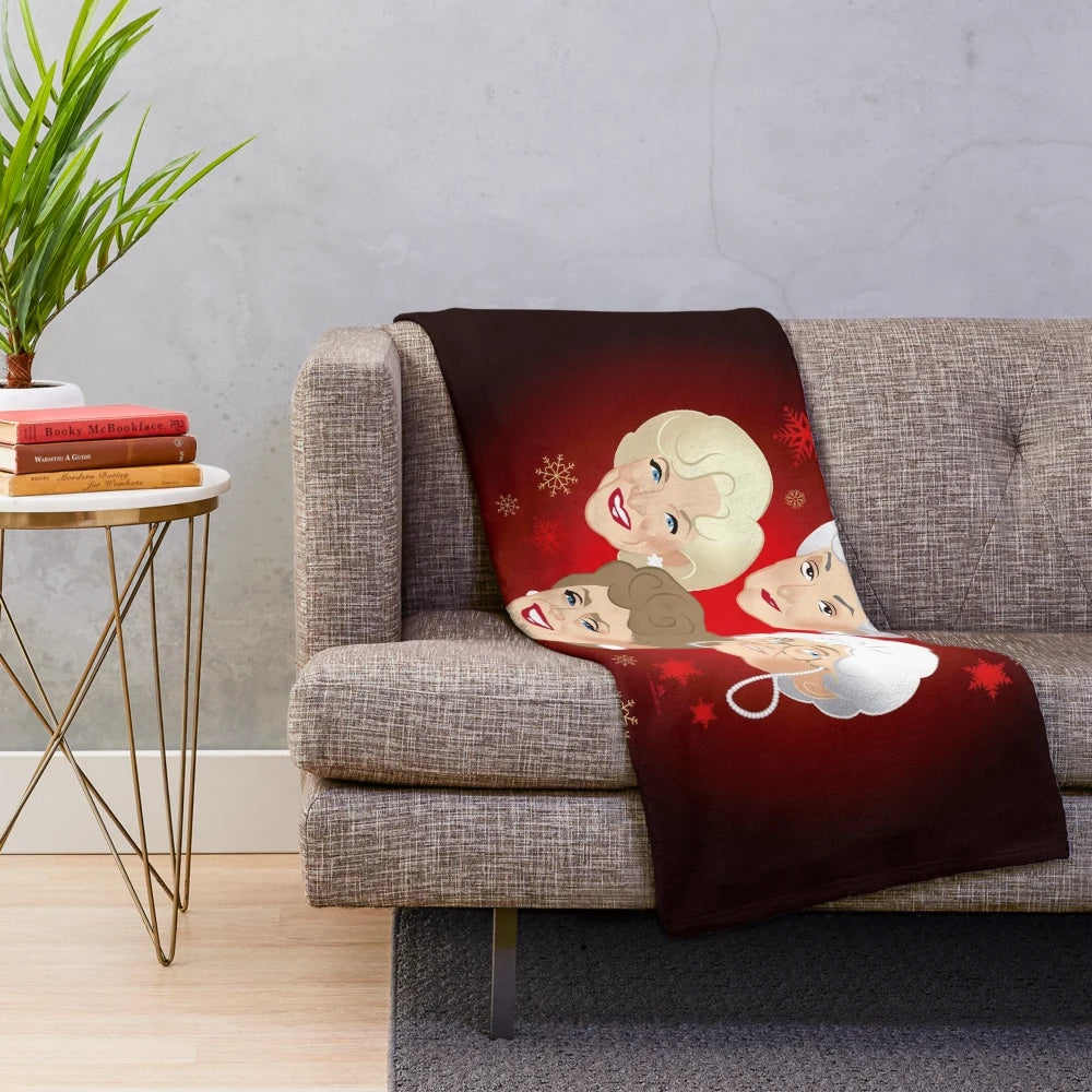 Golden Christmas plush blanket featuring classic TV comedy characters
