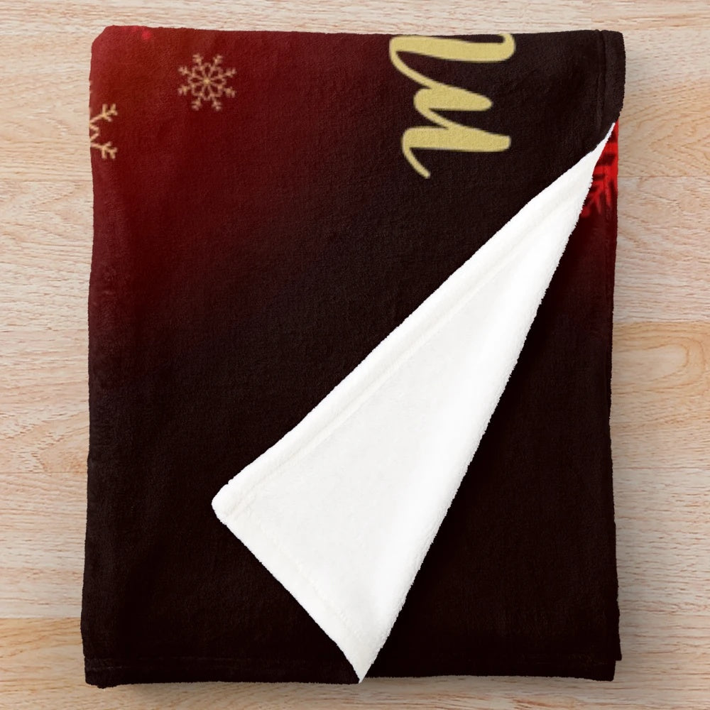 Golden Christmas plush blanket featuring classic TV comedy characters