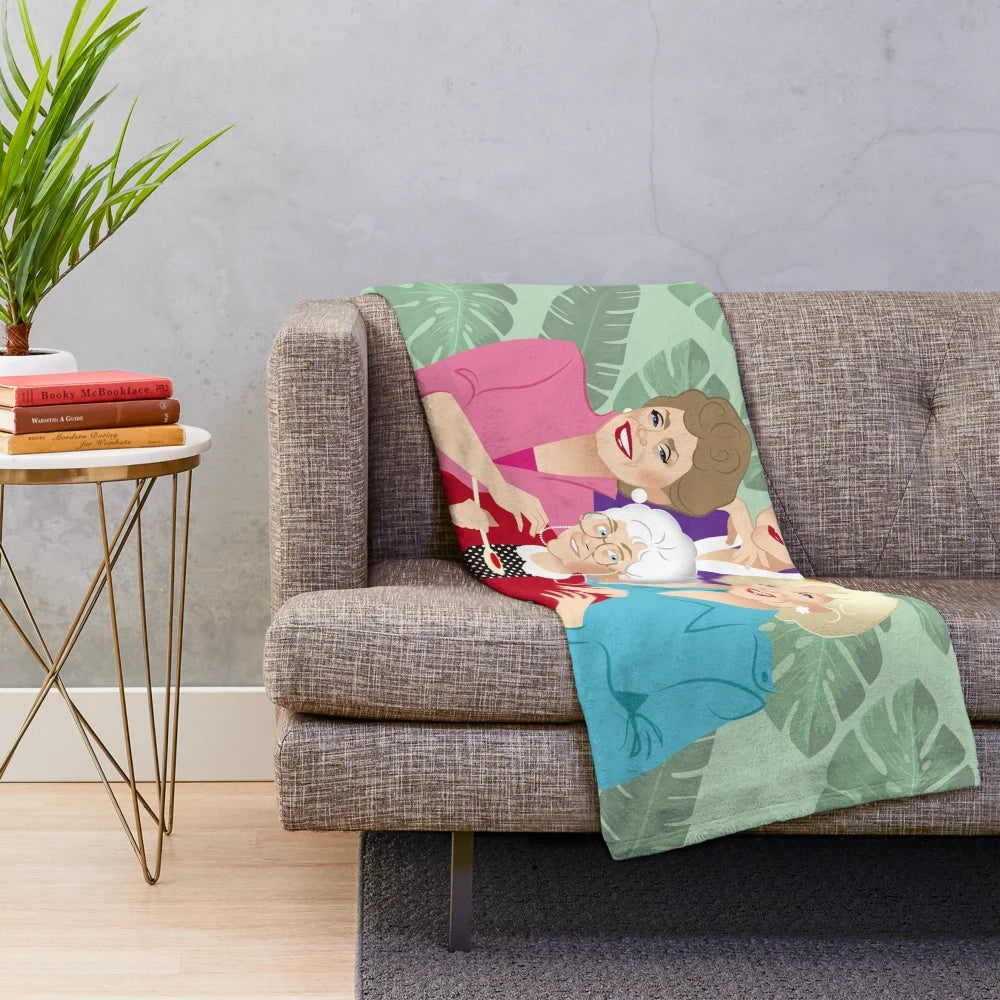 Golden Girls-themed plush blanket featuring Blanche, Dorothy, Rose, and Sophia