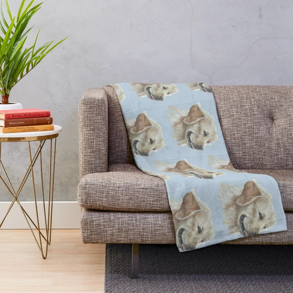 Golden labrador dog curled up on a soft plush blanket