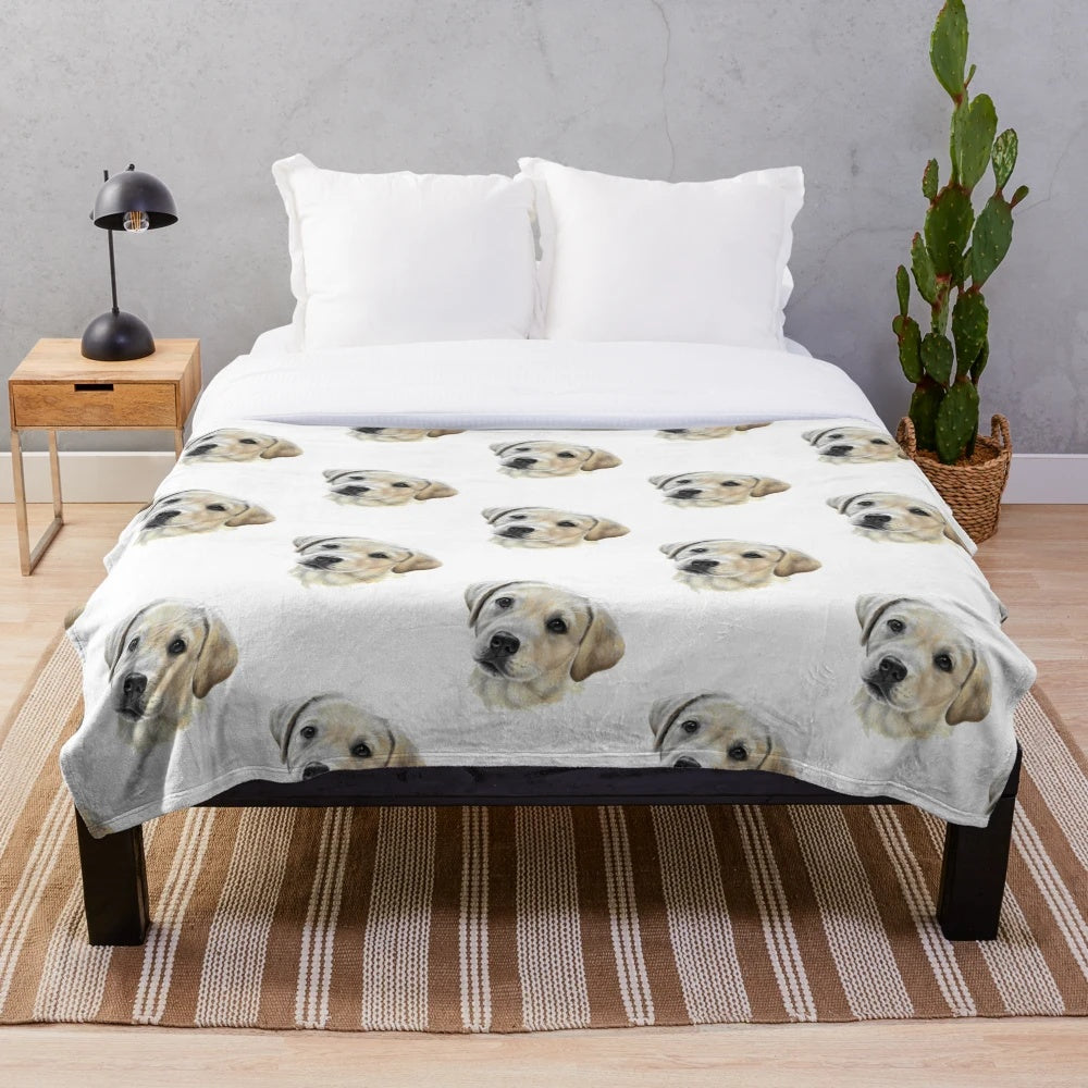 Soft and cuddly golden labrador puppy on a plush blanket