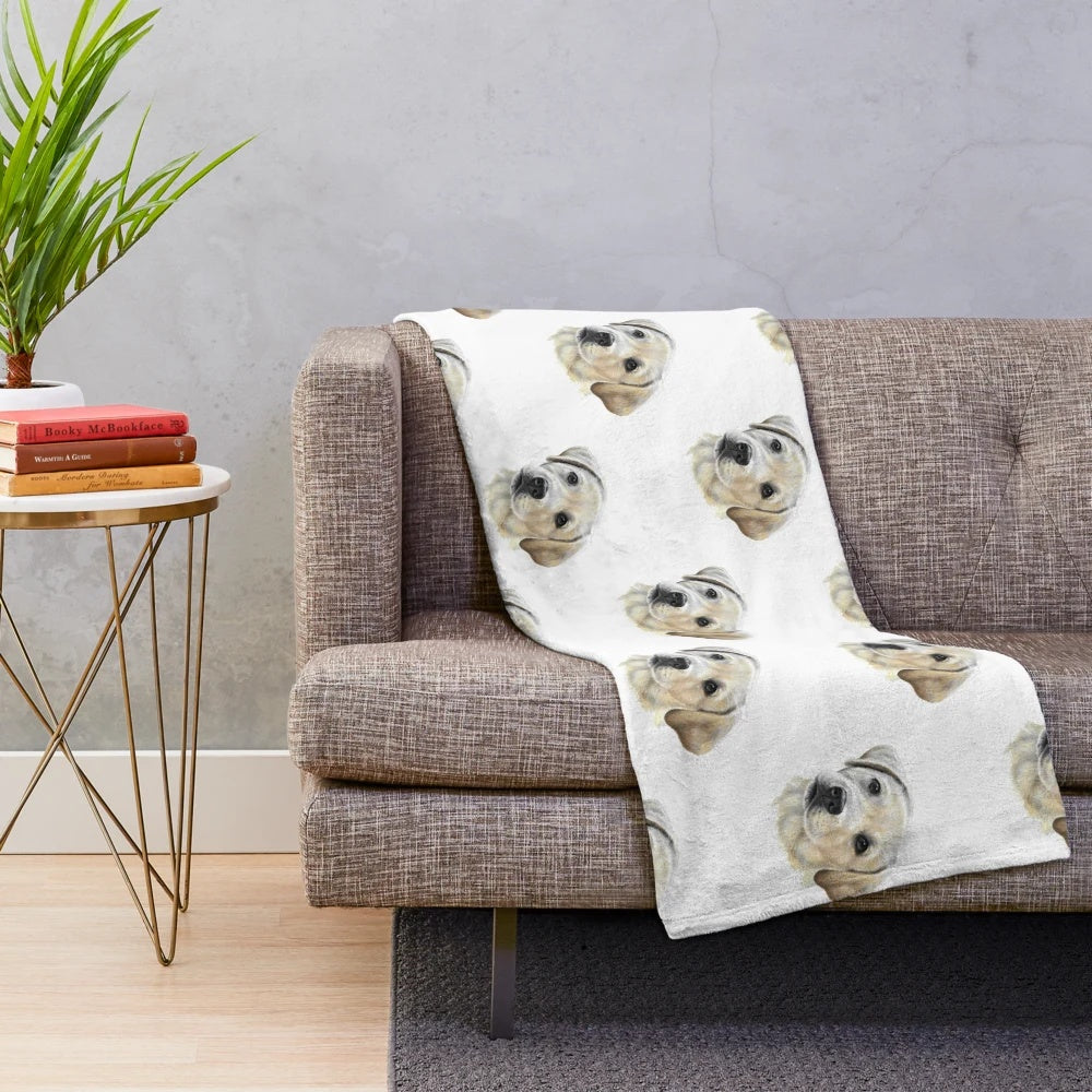 Soft and cuddly golden labrador puppy on a plush blanket