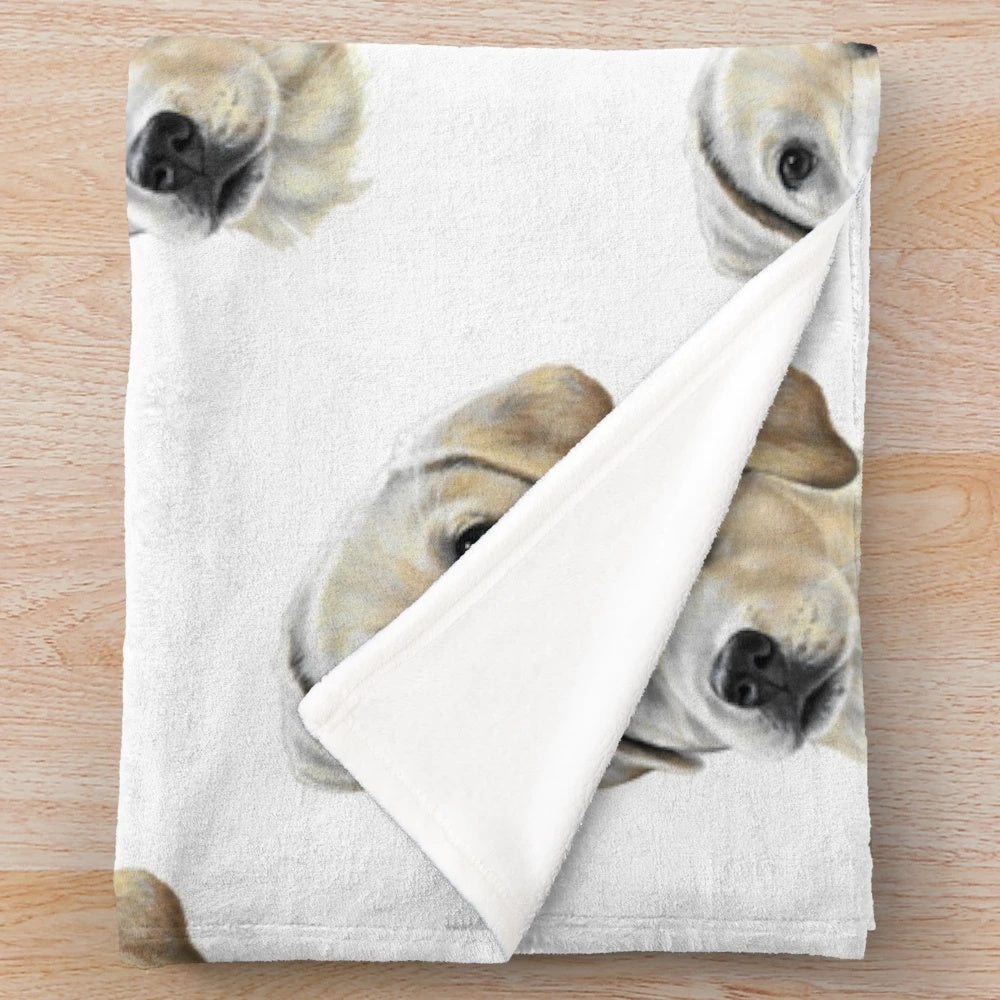 Soft and cuddly golden labrador puppy on a plush blanket