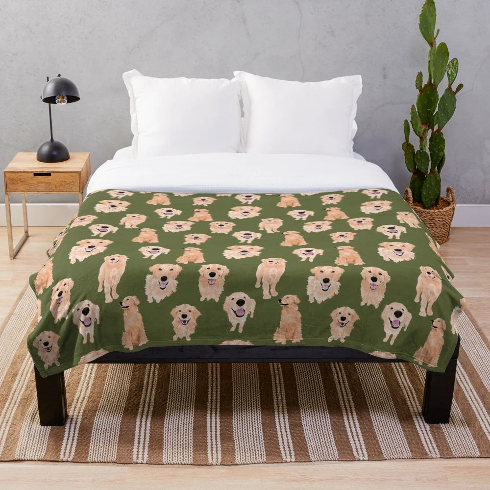 Golden retriever puppy lying on a soft, olive-colored plush blanket