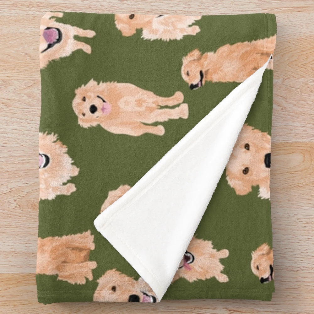 Golden retriever puppy lying on a soft, olive-colored plush blanket