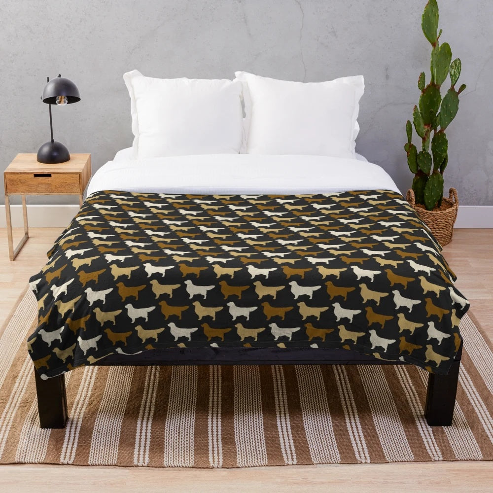 Golden Retriever dog breed silhouette on a plush blanket