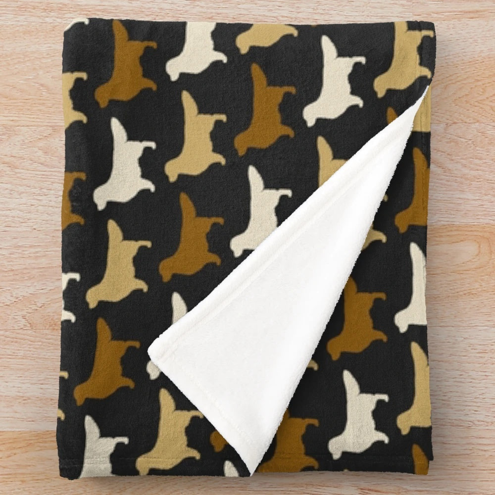 Golden Retriever dog breed silhouette on a plush blanket