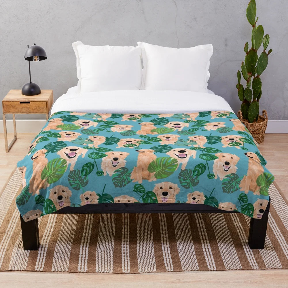 Golden Retriever curled up on a tropical-themed plush blanket