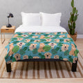 Golden Retriever curled up on a tropical-themed plush blanket