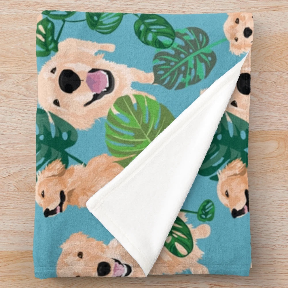 Golden Retriever curled up on a tropical-themed plush blanket