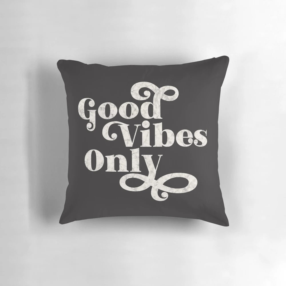 A cozy, decorative pillow with the text "Good Vibes Only" printed on it, promoting a positive and wellness-focused living space.