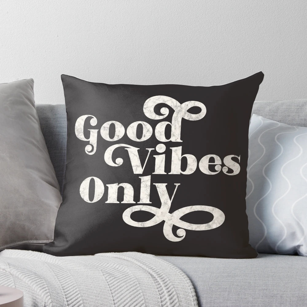 A cozy, decorative pillow with the text "Good Vibes Only" printed on it, promoting a positive and wellness-focused living space.