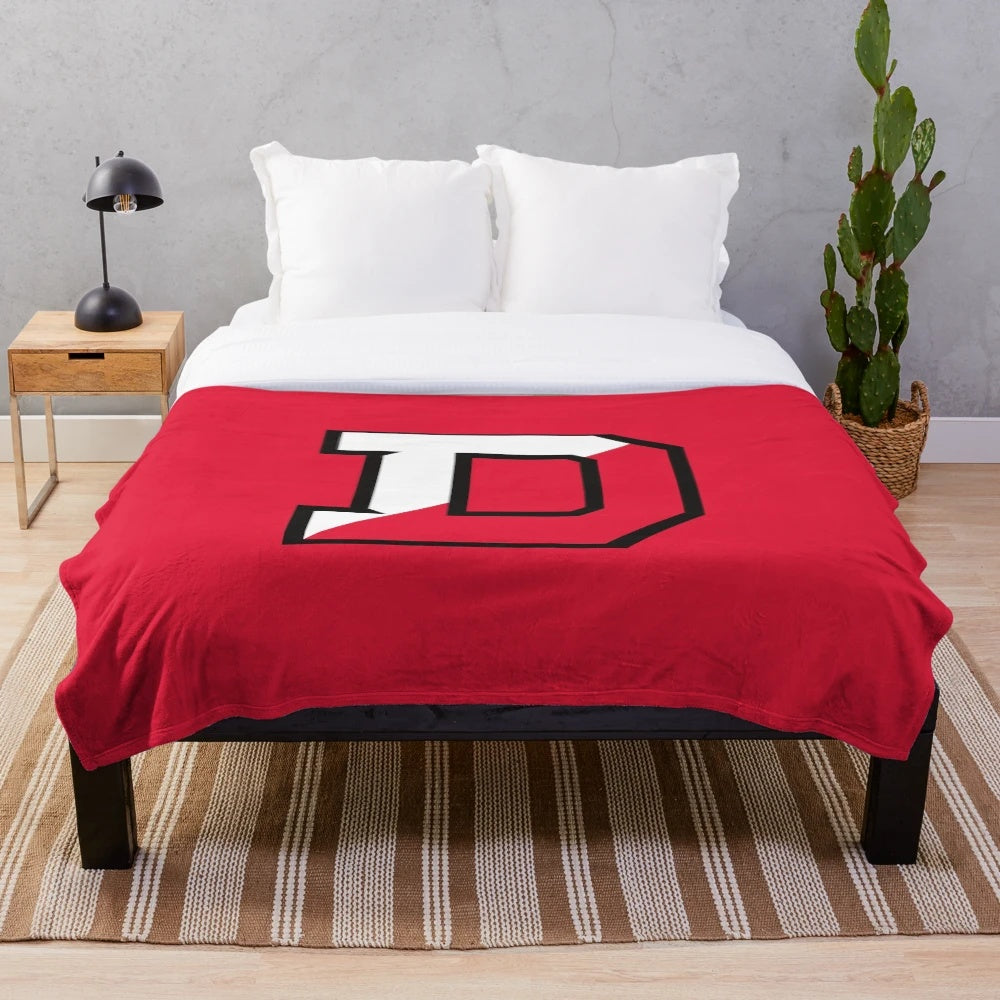 Big red plush blanket featuring the Granville Denison logo