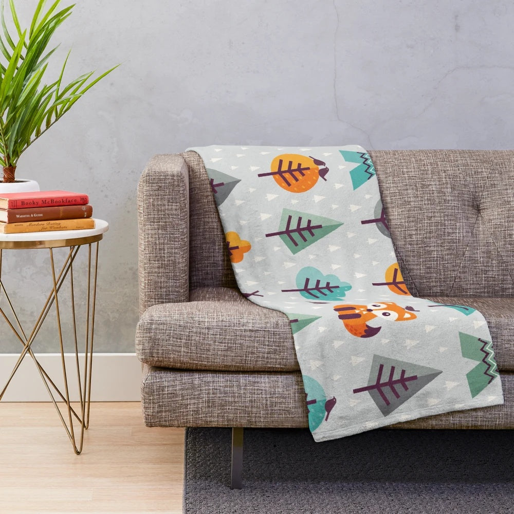 Gray plush blanket with a cute cartoon fox in the forest design