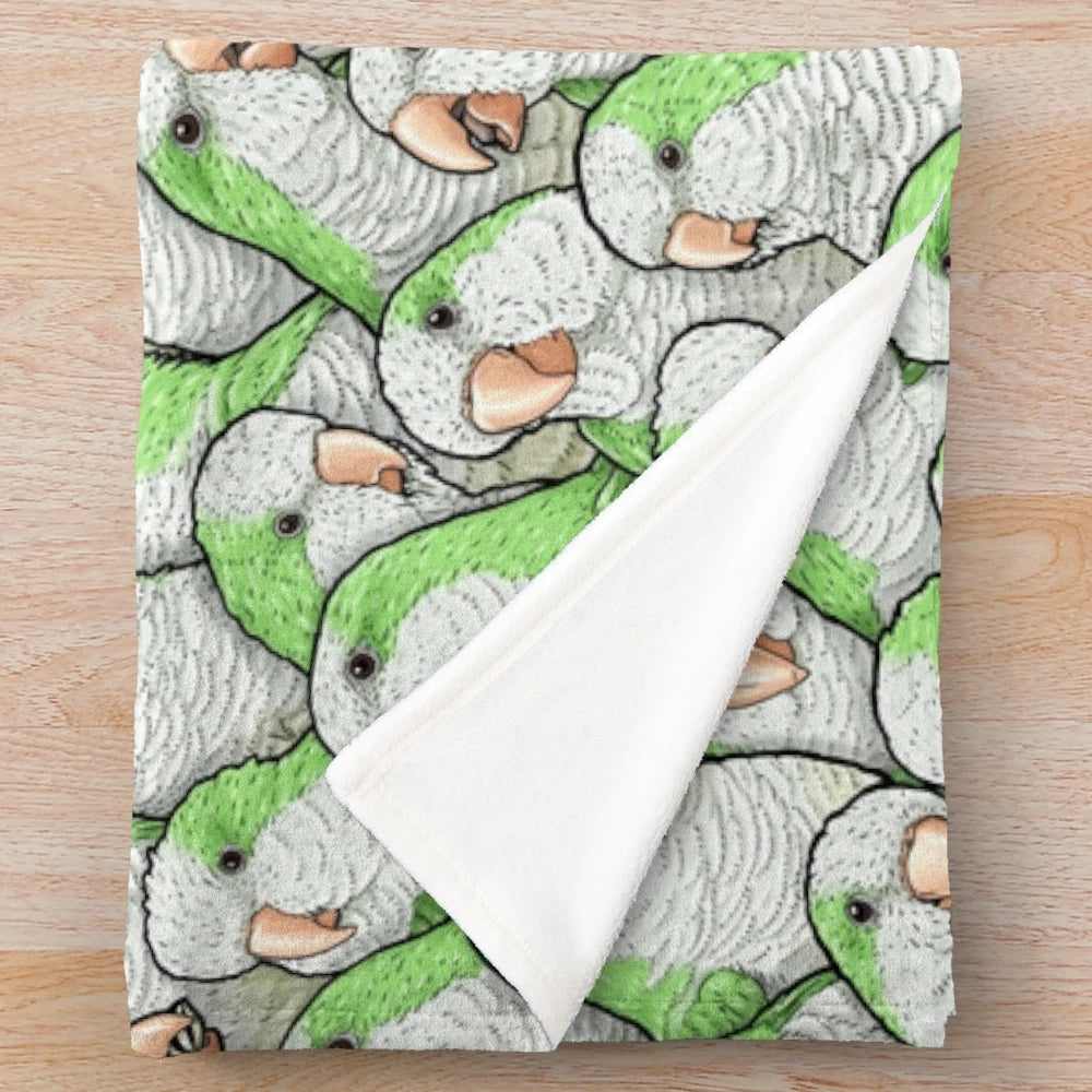 Green plush blanket with cute quaker parakeet design