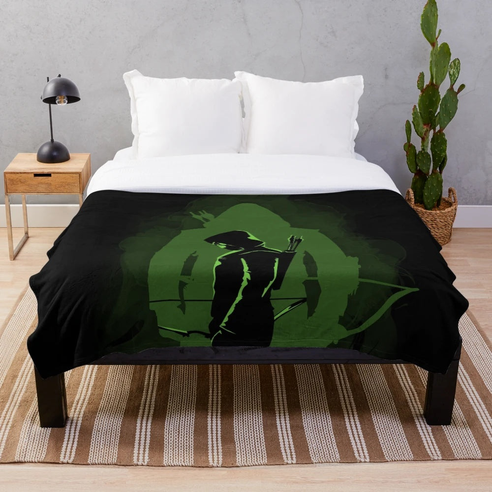 Green plush blanket with superhero-inspired design