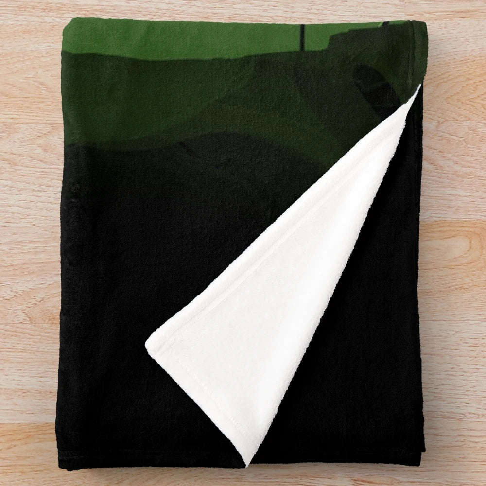 Green plush blanket with superhero-inspired design