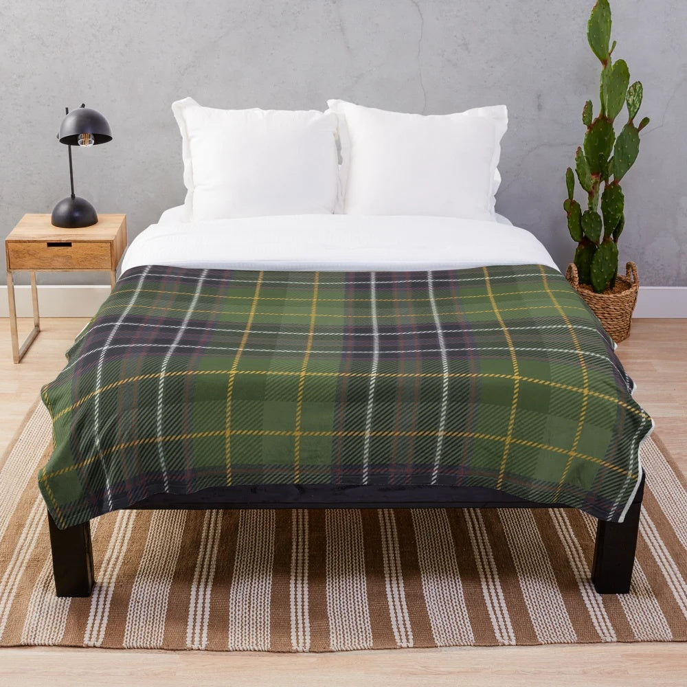 Green tartan plush blanket with nature and floral elements