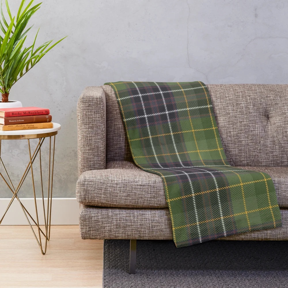 Green tartan plush blanket with nature and floral elements
