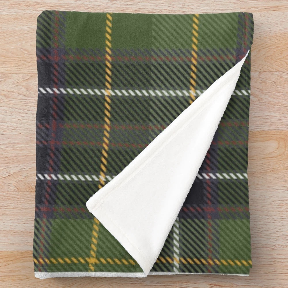 Green tartan plush blanket with nature and floral elements