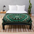 Soft green turtle plush blanket with tribal and ocean-themed graphics