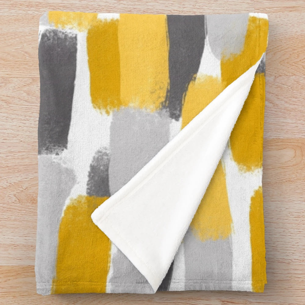 Grey and mustard yellow abstract paint brush effect plush blanket