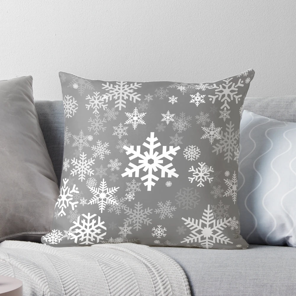 Grey pillow with a delicate snowflake pattern, perfect for winter and holiday home decor