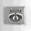 A soft, grey pillow with a playful raccoon print design.