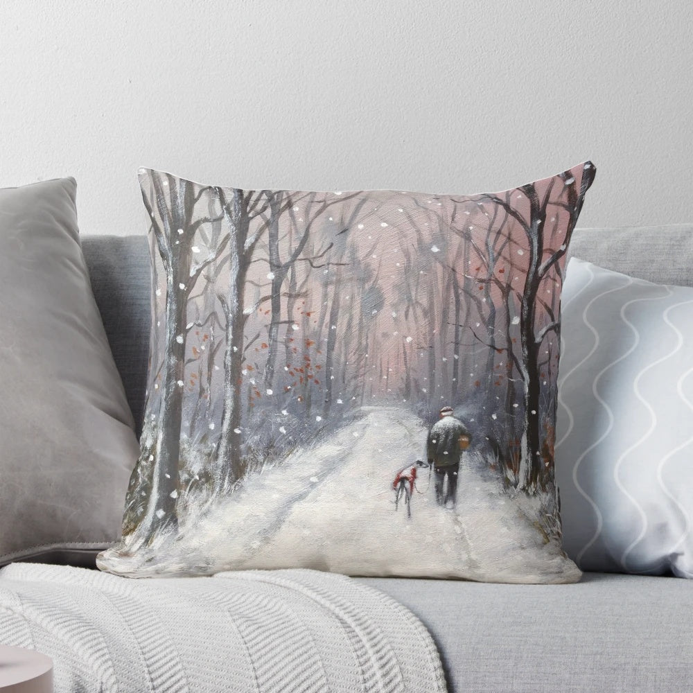 A cozy, winter-themed pillow featuring a charming greyhound or whippet dog in a snowy, holiday landscape.