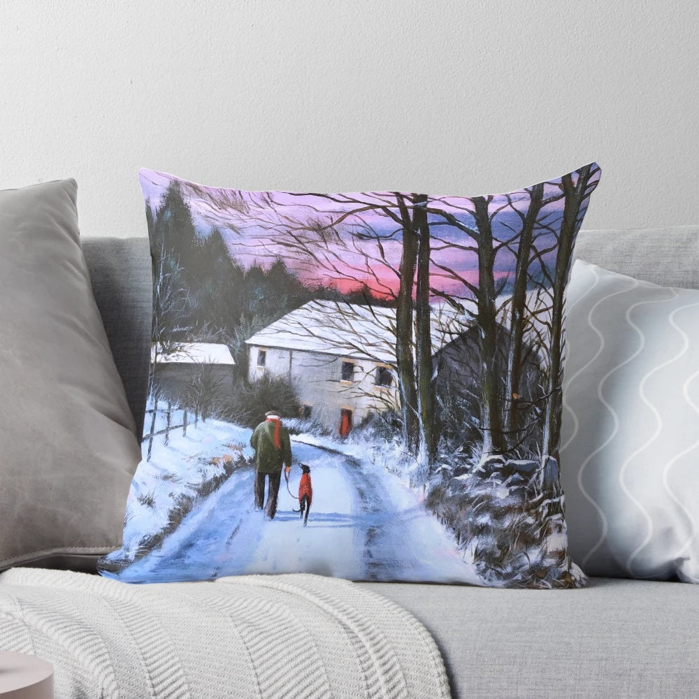 A cozy Pillow featuring a greyhound in a winter landscape with snow and trees.
