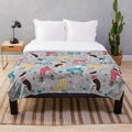 Greyhound plush blanket with colorful dog illustrations