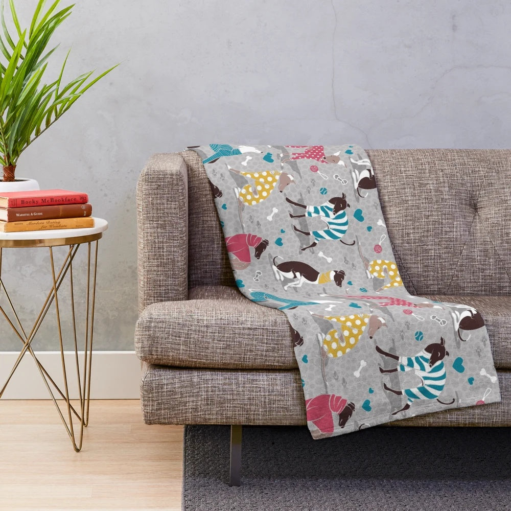 Greyhound plush blanket with colorful dog illustrations