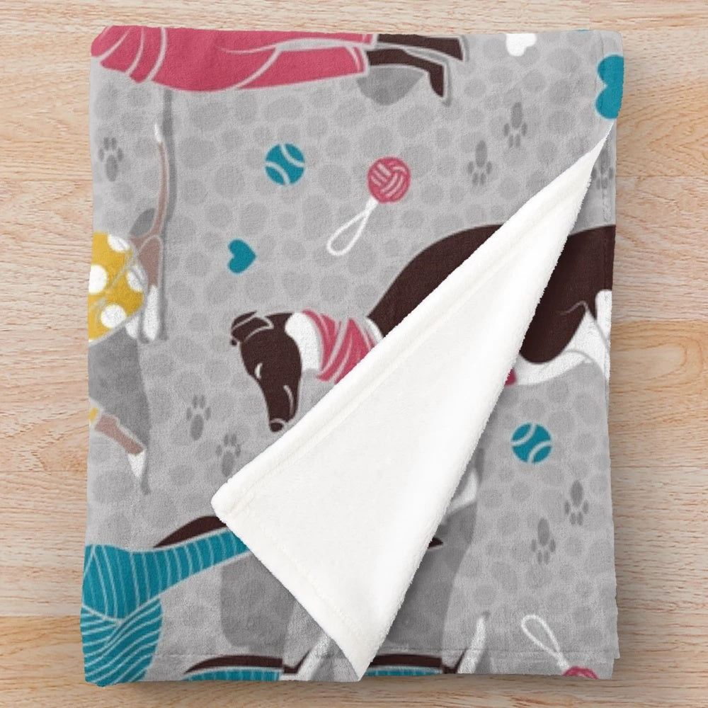 Greyhound plush blanket with colorful dog illustrations
