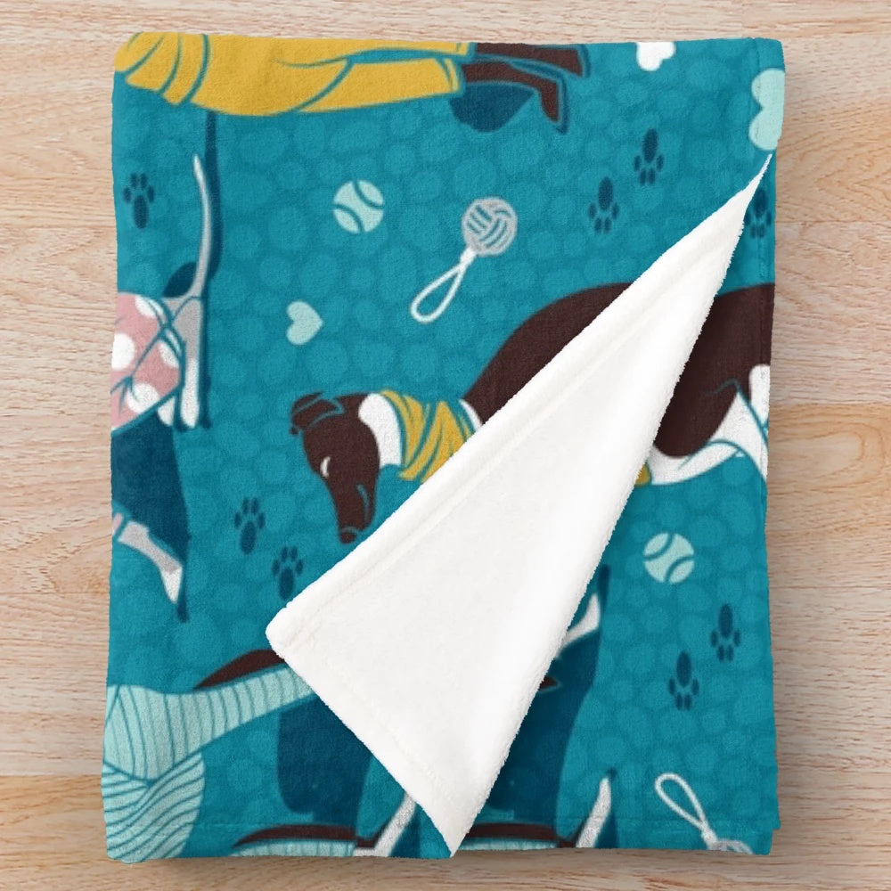 Greyhound plush blanket with turquoise and white design