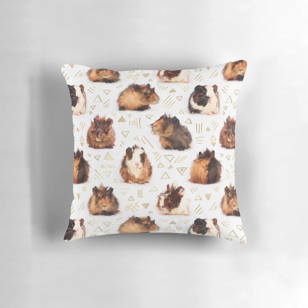 A soft, plush pillow featuring a geometric pattern design and an adorable guinea pig image.