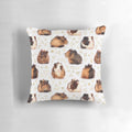 A soft, plush pillow featuring a geometric pattern design and an adorable guinea pig image.