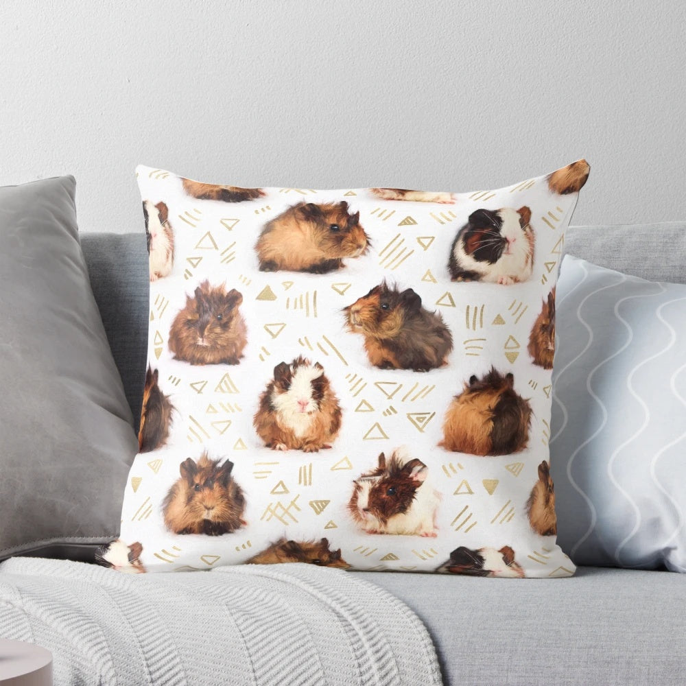 A soft, plush pillow featuring a geometric pattern design and an adorable guinea pig image.