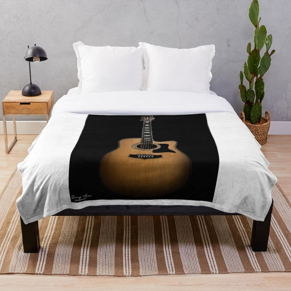 Guitar plush blanket featuring an acoustic guitar design