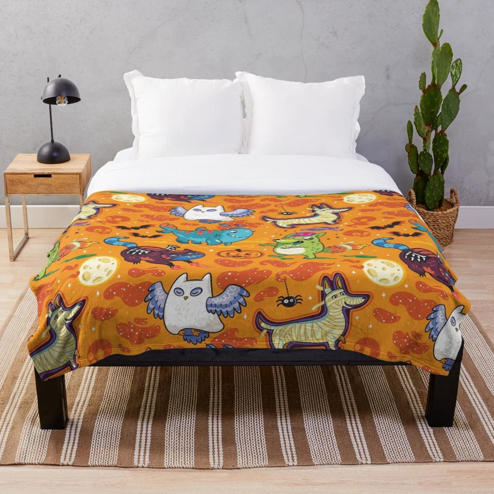 Halloween-themed plush blanket with whimsical design