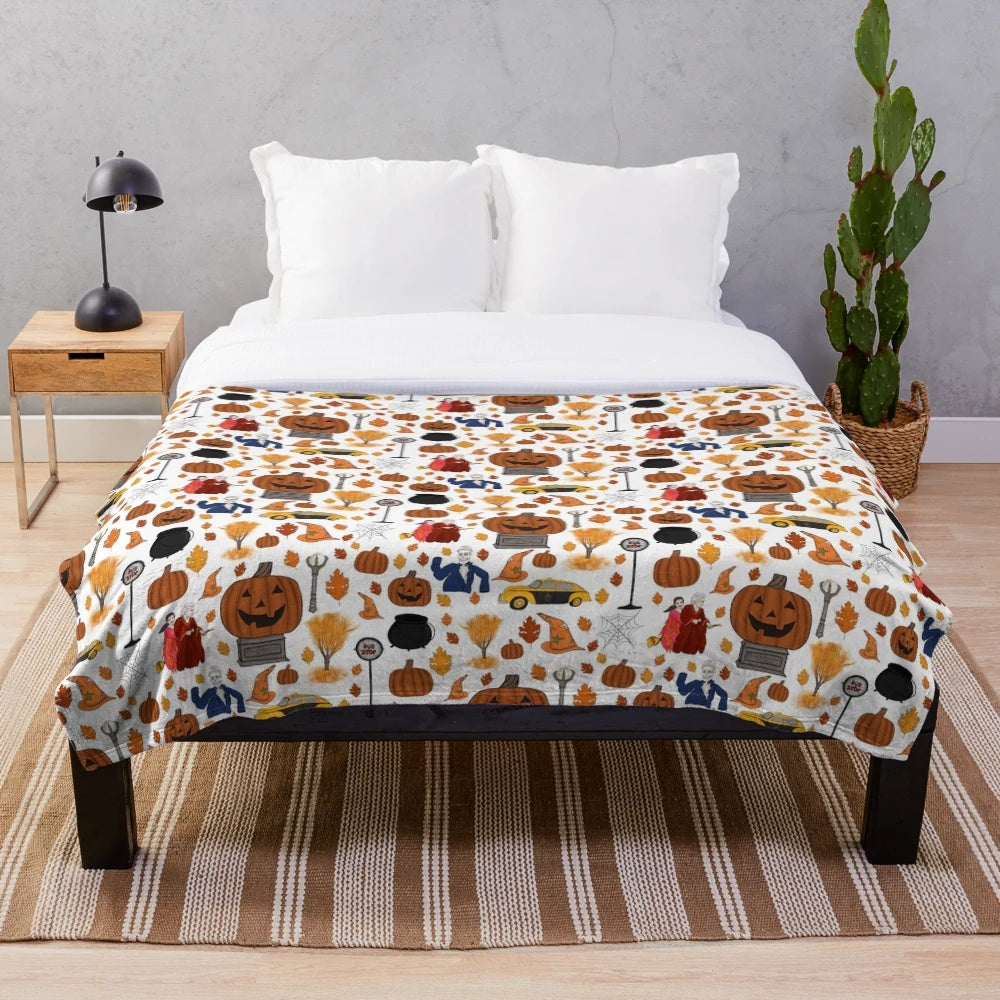 Soft and plush Halloweentown-themed blanket with pumpkins and leaves