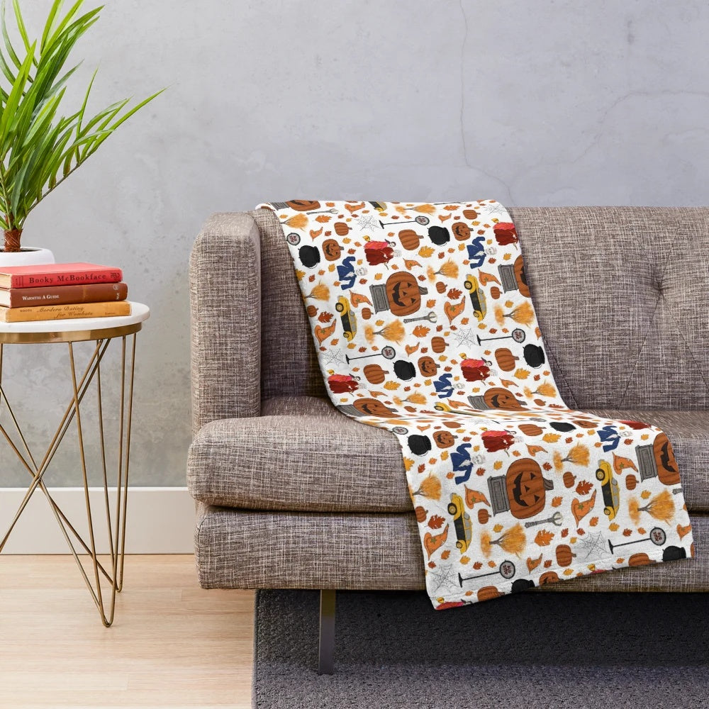 Soft and plush Halloweentown-themed blanket with pumpkins and leaves