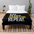Hamilton-themed plush blanket with "Eat Sleep Hamilton Repeat" design