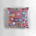 A cozy, handmade crochet pillow in a vibrant vintage granny chic style.