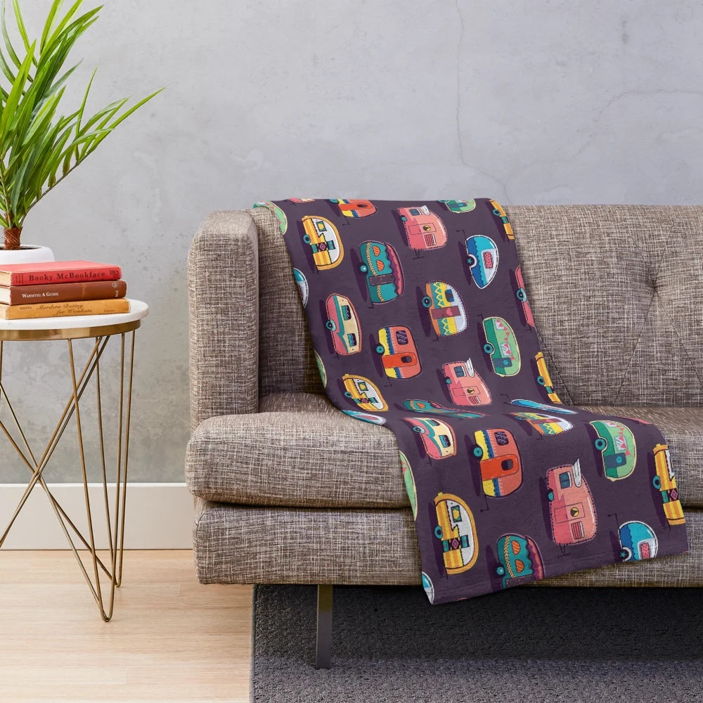 Soft and cozy plush blanket featuring a happy camper design
